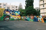 Mural at back and along side of basketball court.