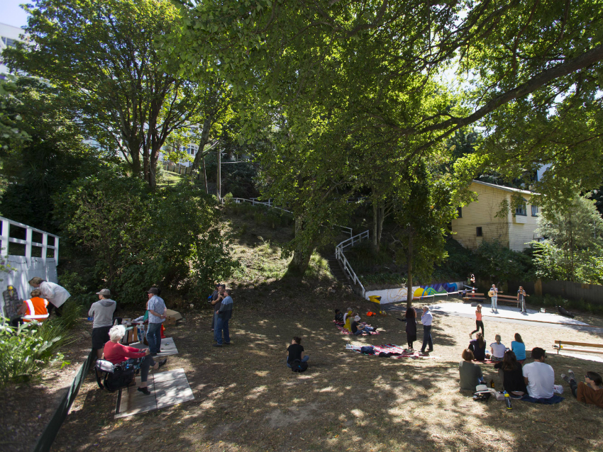 People sitting in the shade of trees at the Flagstaff Hill Park.