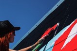 Kelly painting mural.