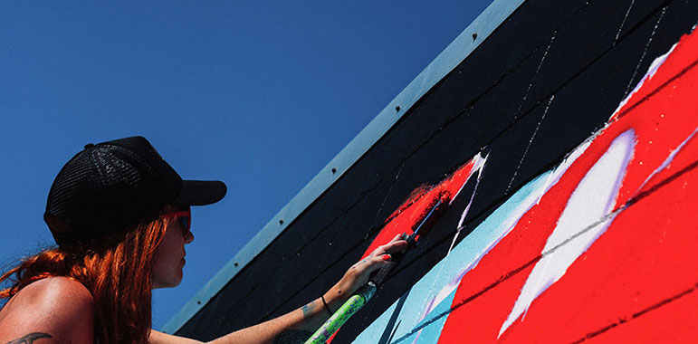 Kelly painting mural.