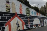 Bottom black and white brickwork with arch images along including entrance to a pa.