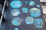 Different size circles with images in a 'spacey' blue/green theme.