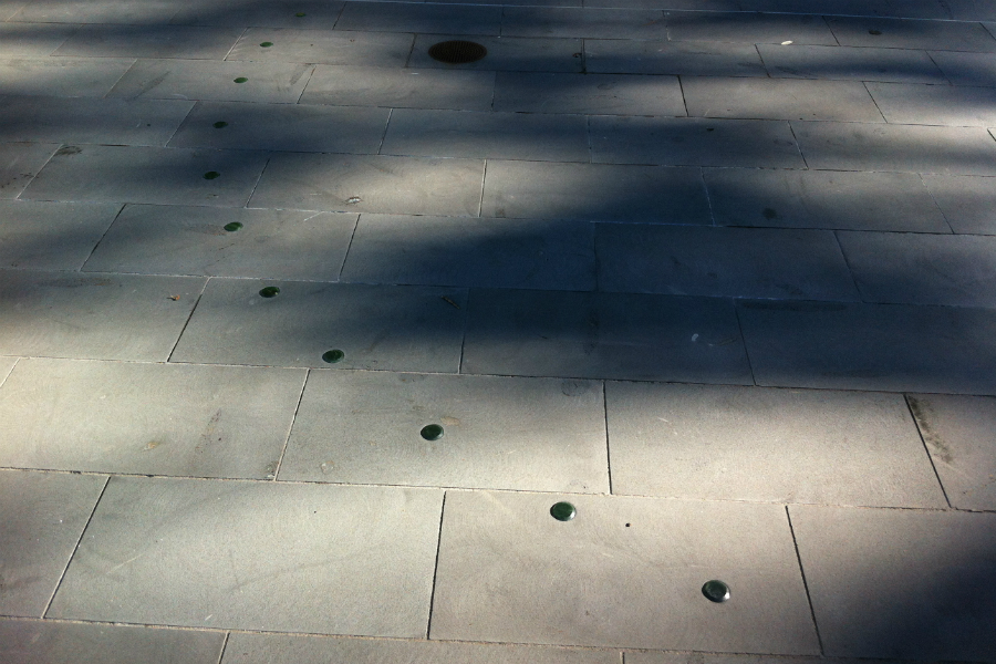 Jade disks in a wavy line across a footpath.