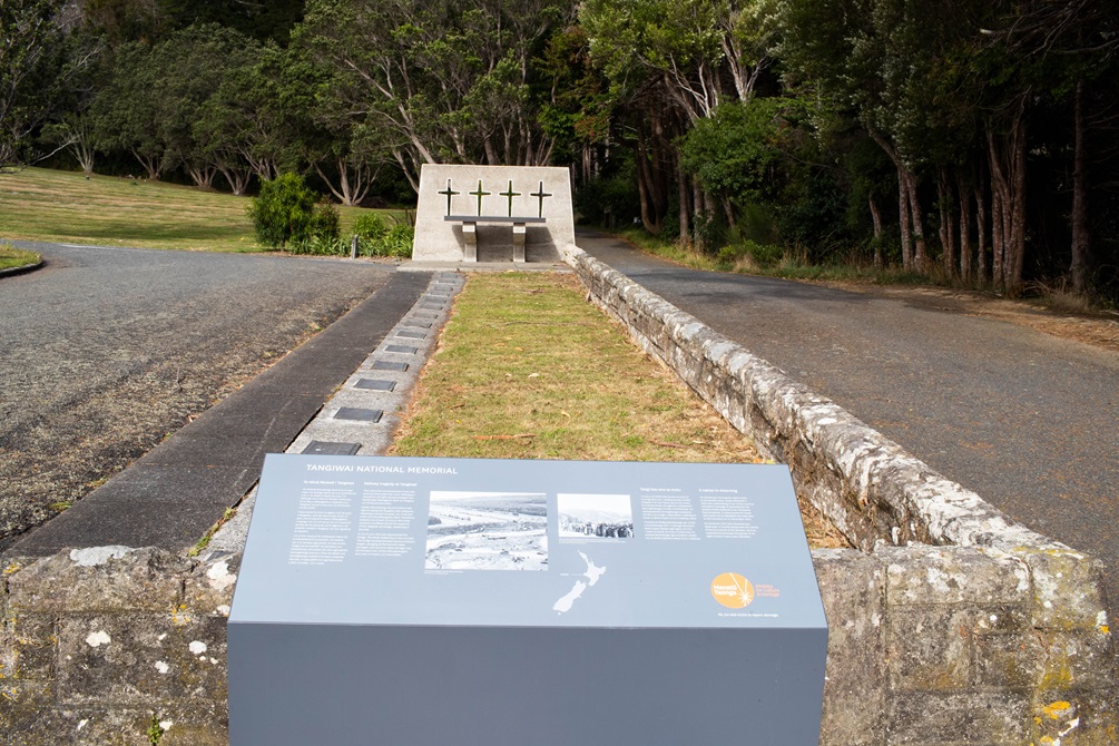 A long narrow piece of lawn with plaques down the side.