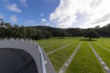 View from main chapel courtyard, showing a large green lawn.