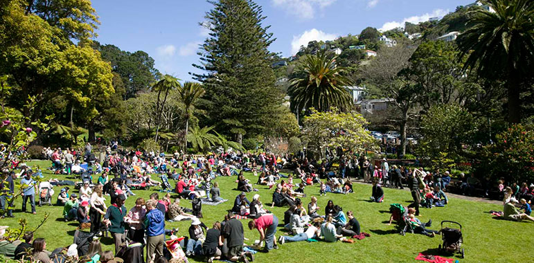 Crowd sitting on The Soundshell lawn.