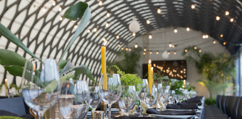 Dining table set for an event in the architecturally designed Kamala room.