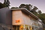 Visitors centre building with the word Zealandia in the entrance.