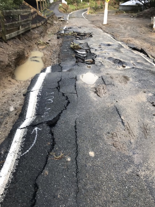 A landslide on a residential road during a weather event.