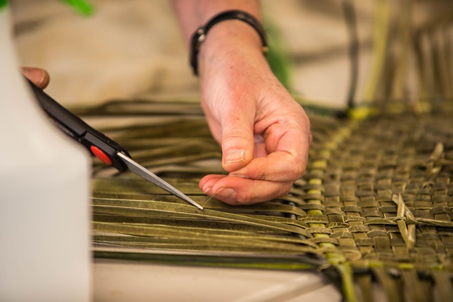 Te Roopu Raranga o Manaia, a Wellington harakeke weaving group, works on Whetūrangi with Maureen Lander