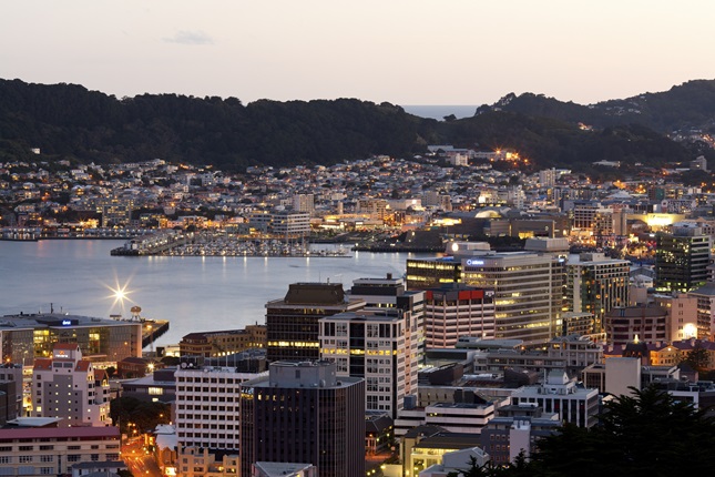 Wellington harbour lit up at night.