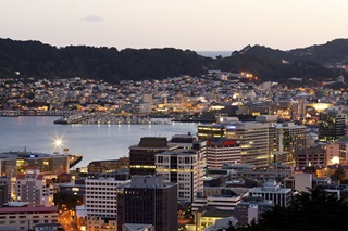 Wellington harbour lit up at night.