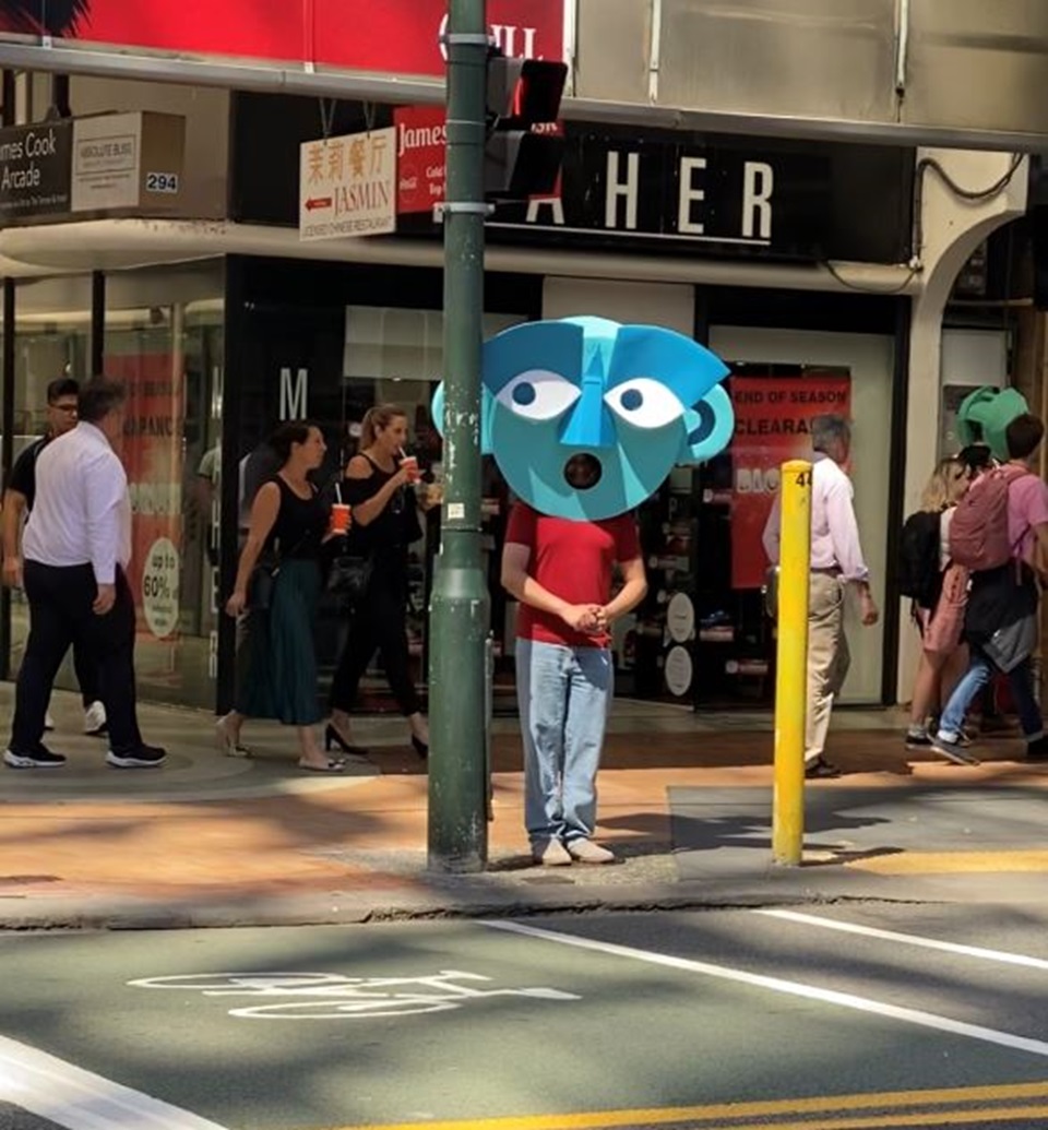 Image of pedestrian safety charachter waiting at crossing as part of awareness campaign