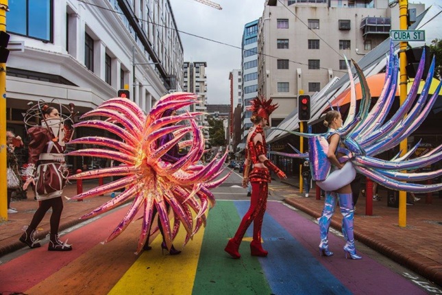 People in WOW outfits on the Dixon Street rainbow crossing.
