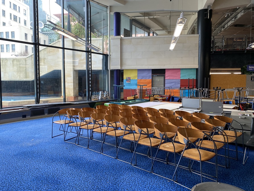 Four rows of wooden chairs all neatly lined up on the ground floor of the Central Library.