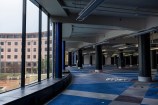 The empty second floor of the Central Library with Civic Square visible through the floor to ceiling windows.