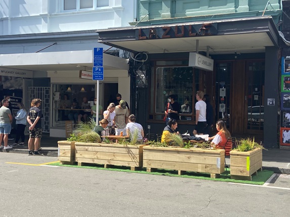 Trial parklet being used by public on Cuba Street