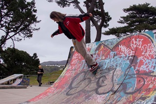 Person on a skateboard on a ramp.