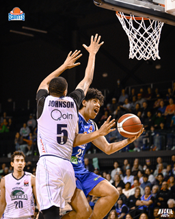 Basketball players on a court.