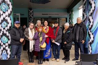 Group of people smiling at the camera.