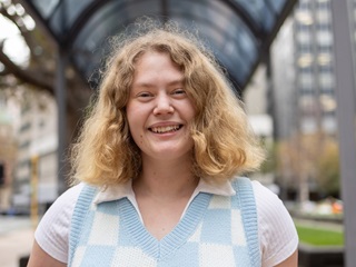 Person smiling at camera.