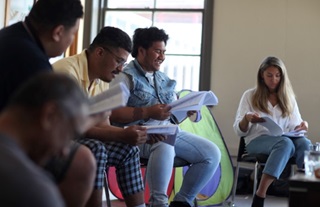 Group of people sitting together.