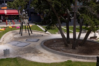 Glover park with sculpture in the background.