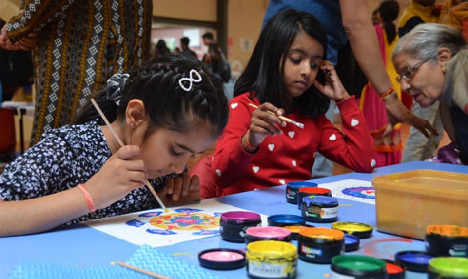 Children painting at Namaste festival