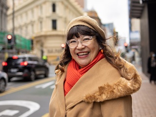 Woman smiling on the street.