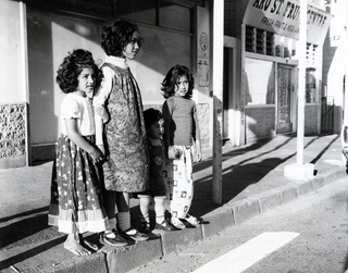Three people on the street. 