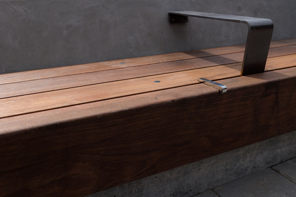 Detail of wooden bench and hand rail.