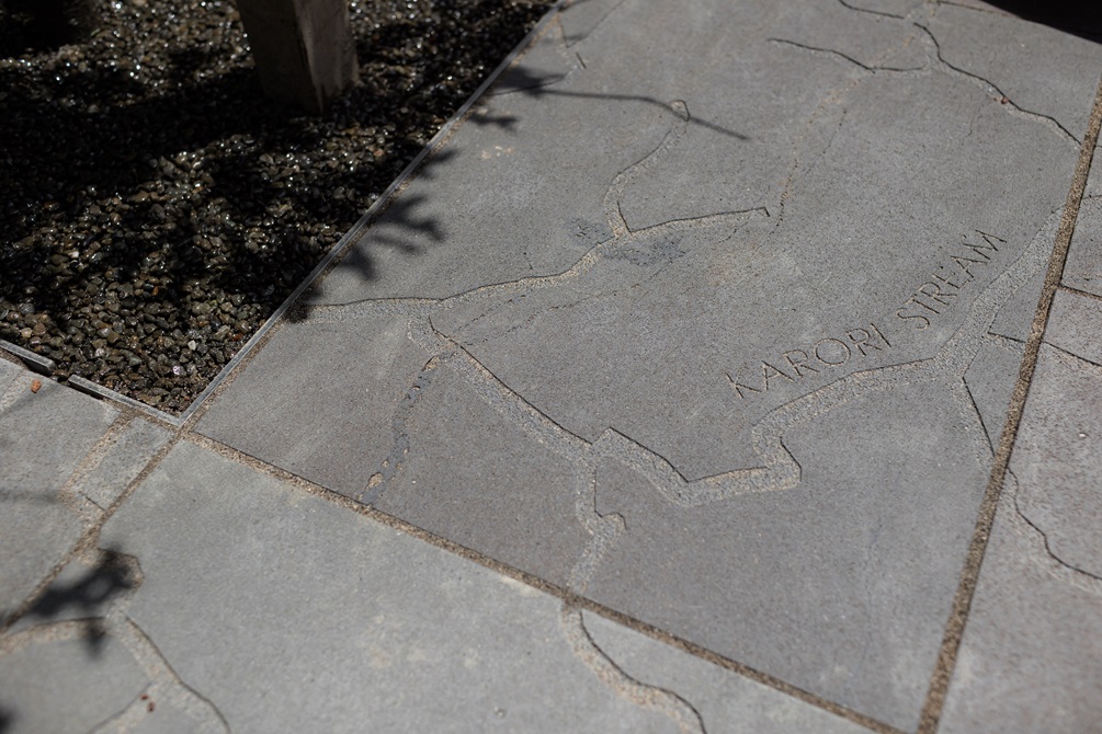 Detail of concrete paving showing engraving of a map of the Karori stream.
