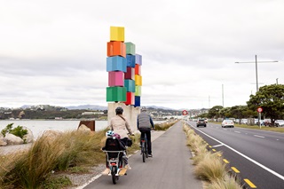Family cycling down Cobham Drive.