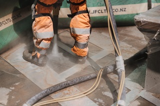 Painting being done on the ground.