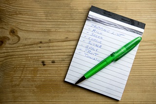 Notepad and pen on a table.