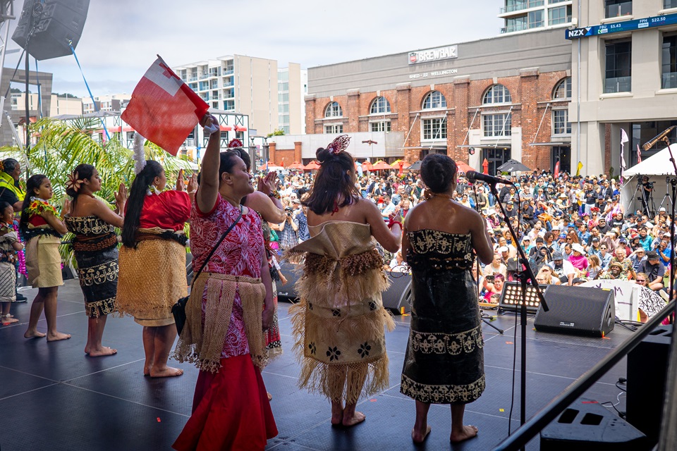 Pasifika Festival performers on stage in front of large crowd on Wellington Waterfront.