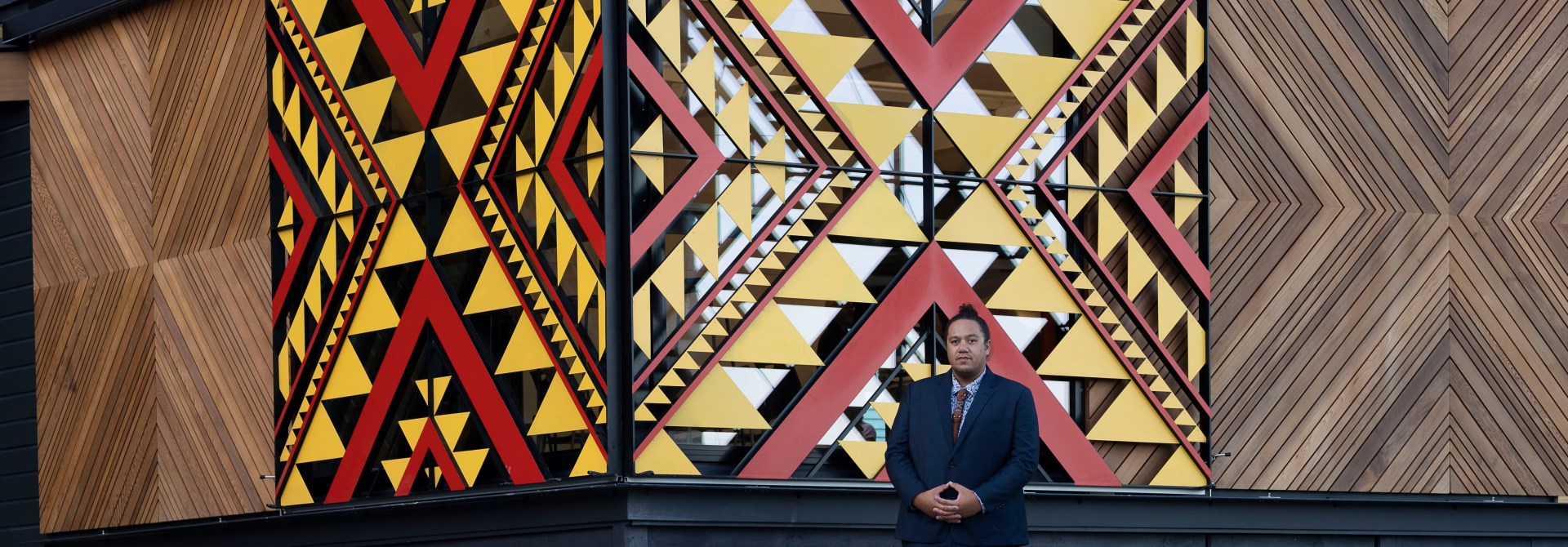 Person standing infront artwork.