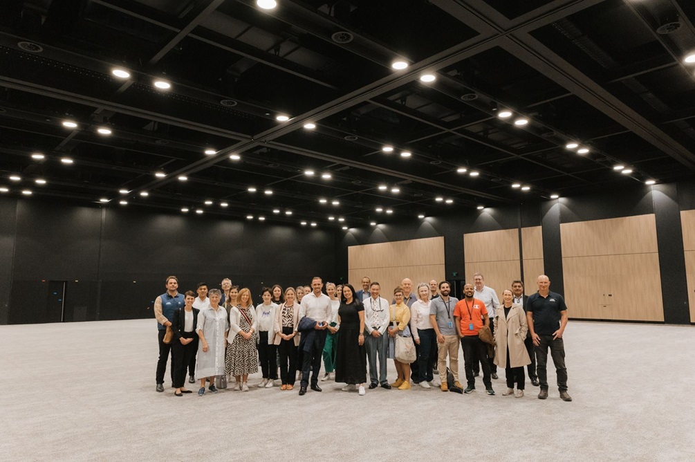 Tākina big room upstairs with tour group and project team