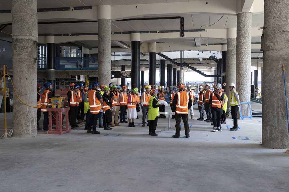 Te Matapihi interior view floor under construction with tour in progress
