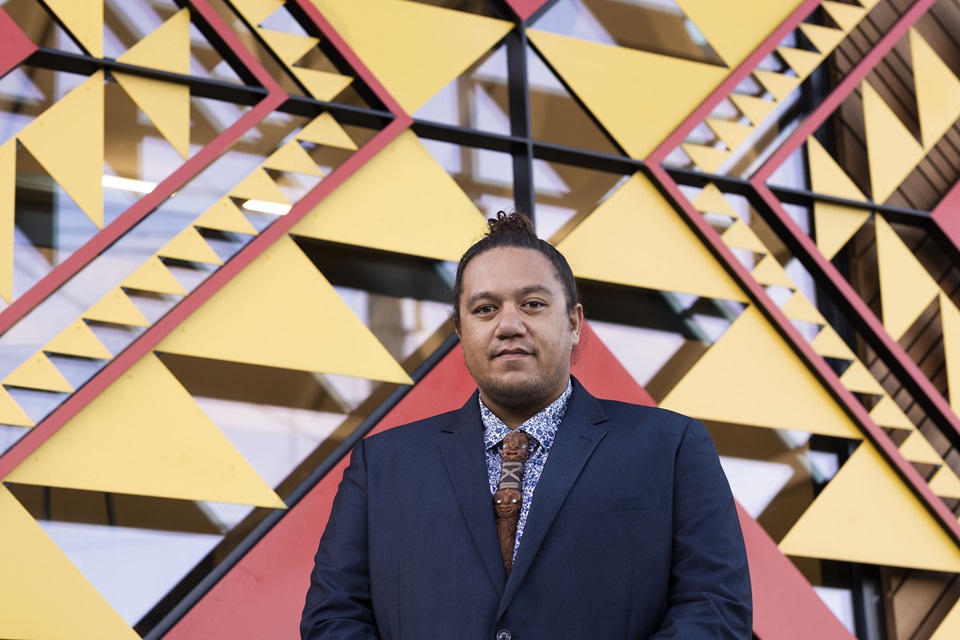 Artist Pōkau Te Ahuru in front of newly upgraded Te Tūhunga Rau Strathmore Community Centre.