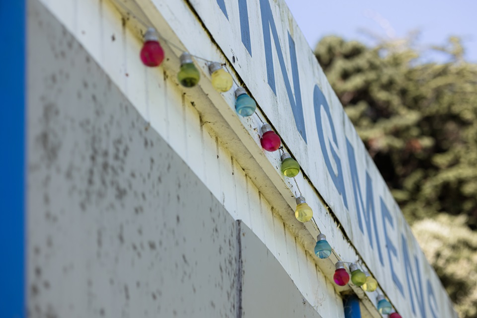 Workingmen's Bowling Club signage with fairy lights hanging