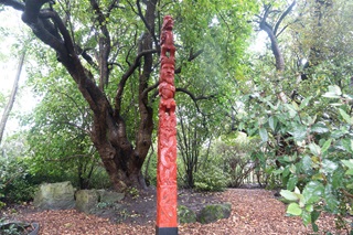 Pou whenua in a garden