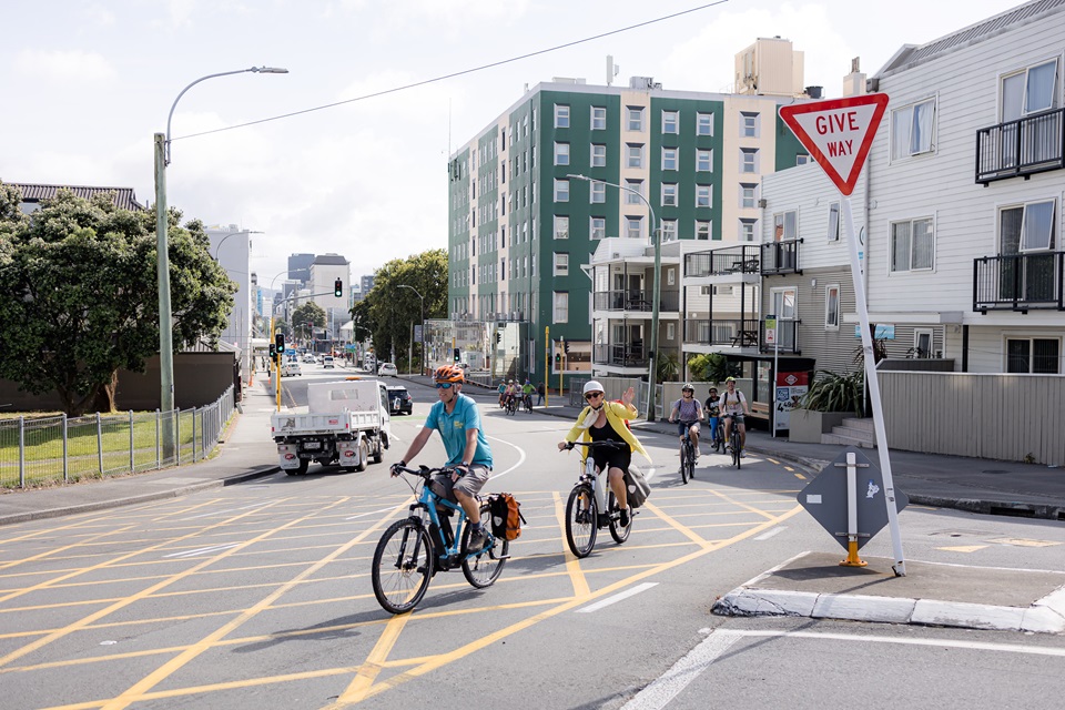 Group on bike tour riding through Te Aro