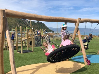 Kids playing on a playground.