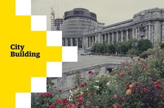 Old photo of the Beehive and parliament grounds with 'city building' written over the top of it.