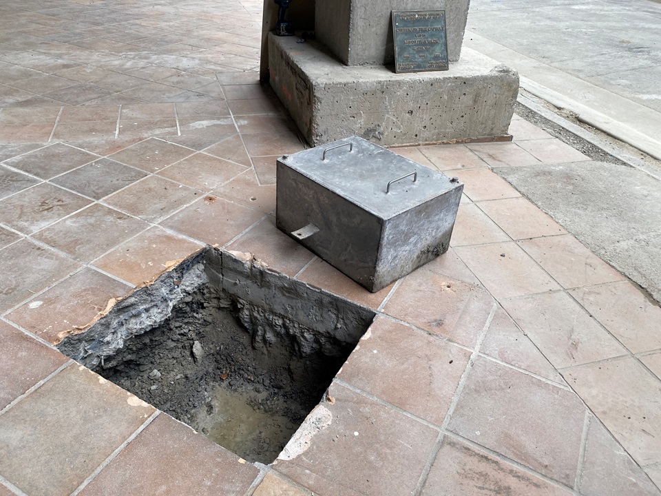 Time capsule uncovered and removed from buried area at front entrance of site of Central Library Te Matapihi.