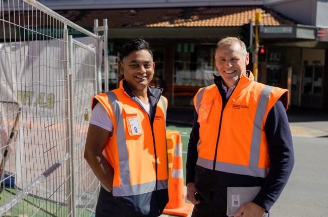 Behind the road cones and high-vis vests
