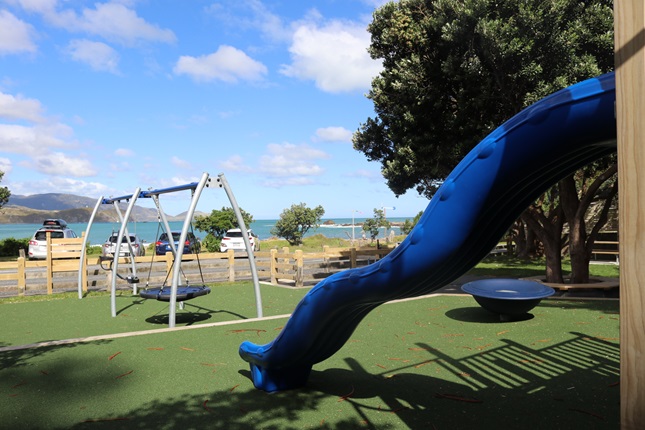 Playground with a slide and swingset.