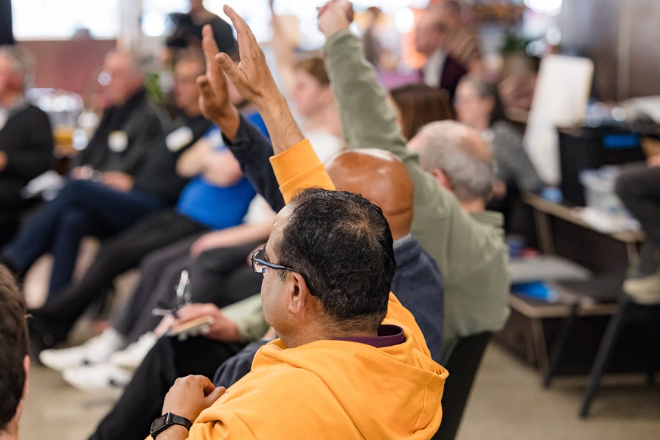 Citizens' Assembly members putting up hands to ask questions