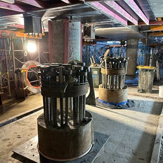 Steel rods grouped together in a basement.